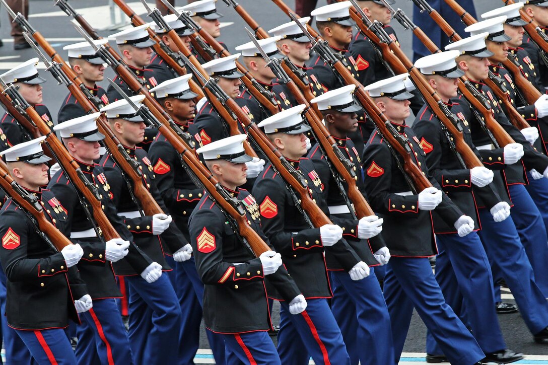 Marines of the U.S. Marine Corps Honor Guard march down Pennsylvania Avenue during the 58th Presidential Inauguration in Washington, D.C., Jan. 20, 2017. Military personnel assigned to Joint Task Force - National Capital Region provided military ceremonial support and Defense Support of Civil Authorities during the inaugural period. (DoD photos by U.S. Army Sgt. Paige Behringer)