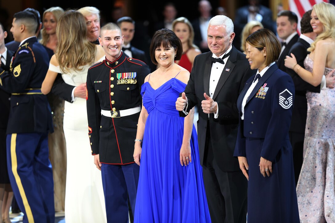 Vice President Michael R. Pence gives two thumbs up to U.S. Air Force Master Sgt. Tiffany Bradbury and Marine Corps Sgt. Angel Rodriguez at the Salute to Our Armed Services Ball at the National Building Museum, Washington, D.C., Jan. 20, 2017. The event, one of three official balls held in celebration of the 58th Presidential Inauguration, paid tribute to members of all branches of the armed forces of the United States, as well as first responders and emergency personnel. (DoD photo by U.S. Army Sgt. Kalie Jones)