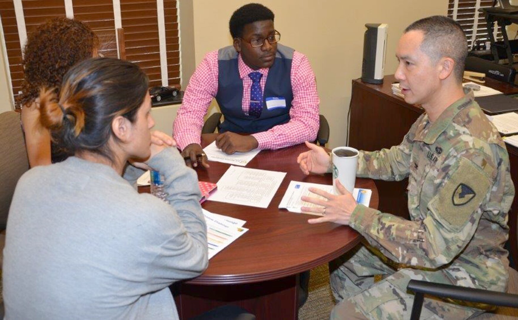 Col. Mike Wong talks to Sam Houston High School students as part of the San Antonio Job Shadow Day Feb. 2 at Joint Base San Antonio-Fort Sam Houston. Wong is the Mission and Installation Contracting Command chief counsel.