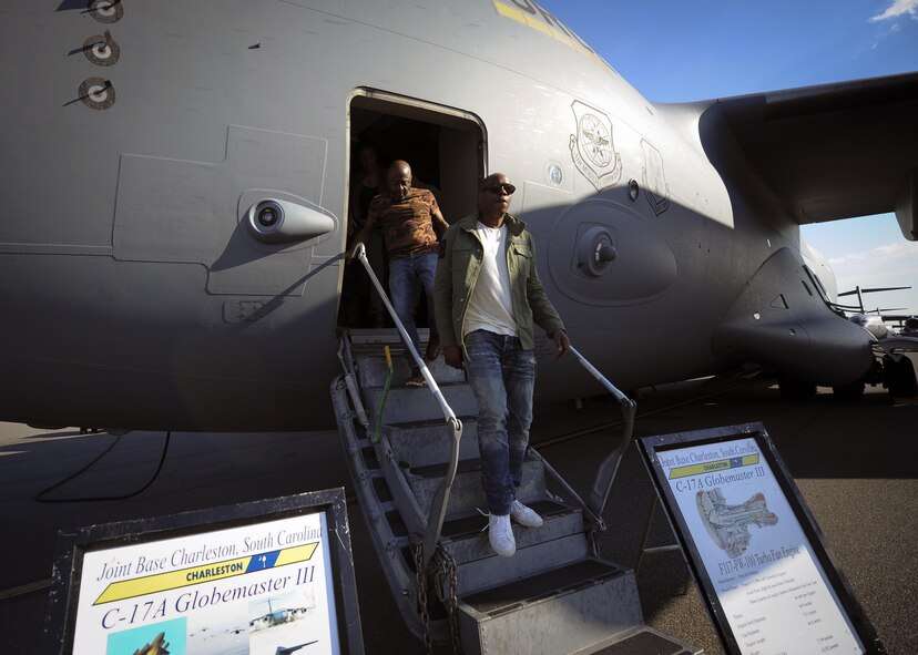(From right) Actor/comedian Dave Chappelle, and actor/comedian Donnell Rawlings exit a C-17 Globemaster III static display during a visit to the troops at Joint Base Charleston Feb. 2 . Chappelle & Rawlings were in town as part of their comedy tour.  After touring a C-17, the two were welcomed by an eager crowd of over 200 military members and federal civilians at the Charleston Club.  (U.S. Air Force photo by Senior Airman Tom Brading)