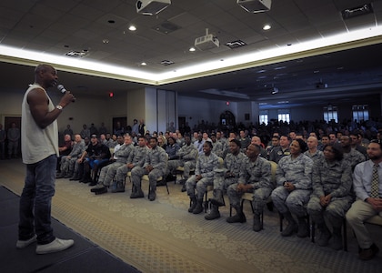 Actor/comedian Dave Chappelle tells a few jokes and thanks military members at the Charleston Club at Joint Base Charleston, S.C. Feb. 2  Chappelle was in town for his stand-up comedy show when he made the visit to see service members and federal civilians at the base. (U.S. Air Force photo by Senior Airman Tom Brading)