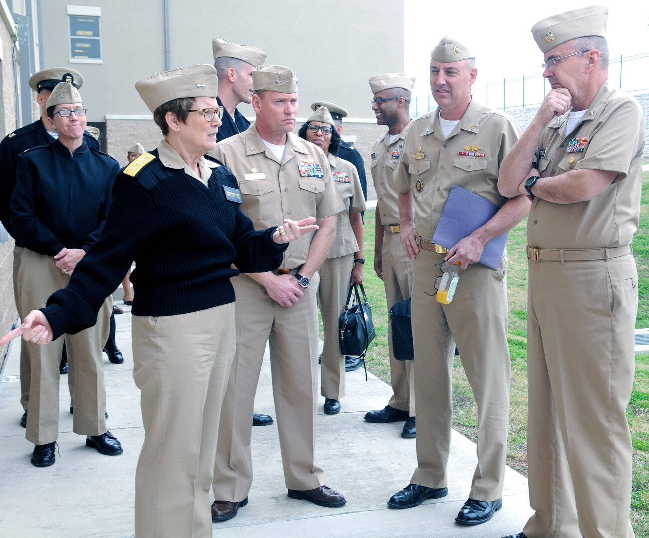 Rear Adm. Rebecca J. McCormick-Boyle, commander, Navy Medicine Education, Training and Logistics Command (NMETLC), talks to Vice Adm. C. Forrest Faison III, Navy surgeon general, during a tour of the Navy barracks at the Medical Education and Training Campus (METC) at Joint Base San Antonio-Fort Sam Houston Feb. 1. Faison visited San Antonio to talk to personnel at NMETLC as well as the Navy service component of METC, Navy Medicine Training Support Center.