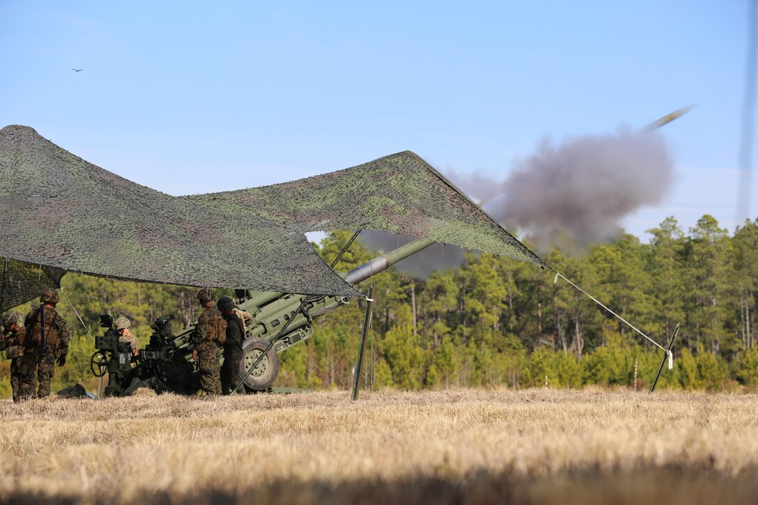 Marines execute a fire mission while utilizing a M777 howitzer during a training exercise at Camp Lejeune, N.C., Feb, 1, 2017. Through repetitions of firing the Marines improved their combat readiness, aiding the 2nd Marine Division and maximizing its effectiveness on the battlefield.  The Marines are artillerymen assigned to 2nd Battalion, 10th Marine Battery. (Marine Corps photo by Cpl. Shannon Kroening)
