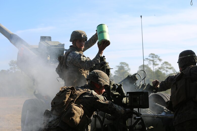 Marines execute a fire mission while utilizing a M777 howitzer during a training exercise at Camp Lejeune, N.C., Feb, 1, 2017. Through repetitions of firing the Marines improved their combat readiness, aiding the 2nd Marine Division and maximizing its effectiveness on the battlefield.  The Marines are artillerymen assigned to 2nd Battalion, 10th Marine Battery. (Marine Corps photo by Cpl. Shannon Kroening)