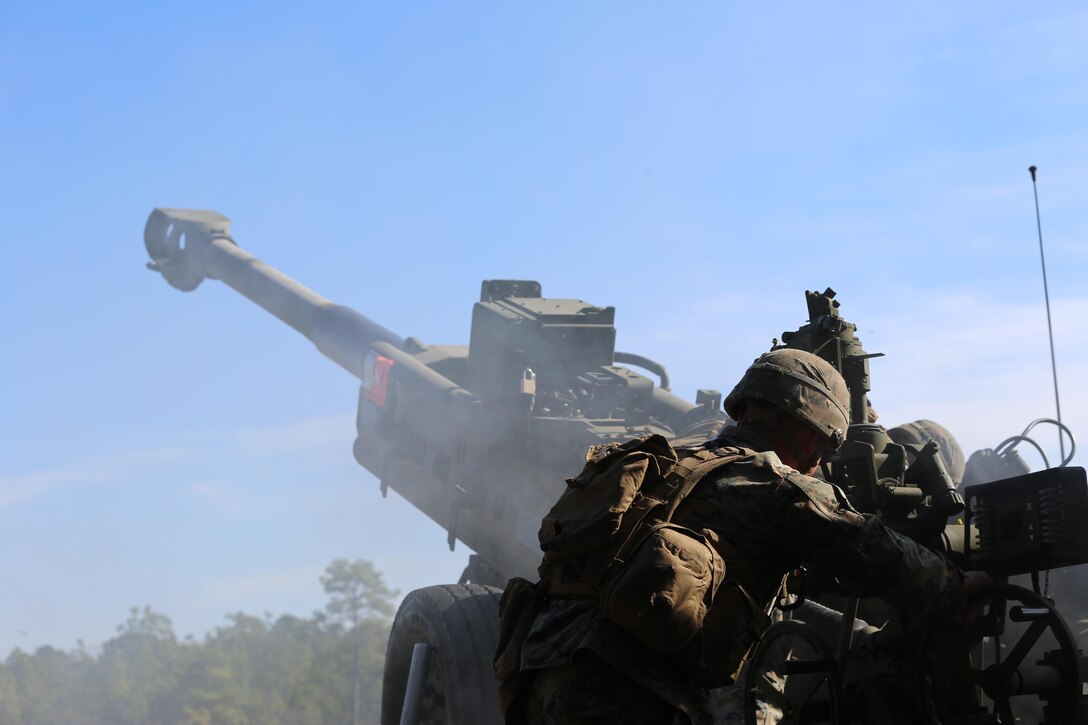 Marines execute a fire mission while utilizing a M777 howitzer during a training exercise at Camp Lejeune, N.C., Feb, 1, 2017. Through repetitions of firing the Marines improved their combat readiness, aiding the 2nd Marine Division and maximizing its effectiveness on the battlefield.  The Marines are artillerymen assigned to 2nd Battalion, 10th Marine Battery. (Marine Corps photo by Cpl. Shannon Kroening)