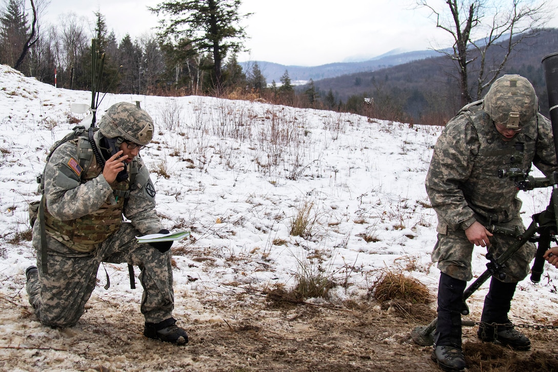 Army National Guard Army Sgt. Noah Nelson, left, receives a fire mission form his leadership team while Sgt. Jonah Breer sights in a 120 mm mortar system during a live-fire exercise at Camp Ethan Allen Training Site, Jericho, Vt., Jan. 26, 2017. Nelson and Breer are assigned to the Vermont Army National Guard’s Headquarters Company, 3rd Battalion, 172nd Infantry Regiment, 86th Infantry Brigade Combat Team (Mountain). Army National Guard photo by Spc. Avery Cunningham