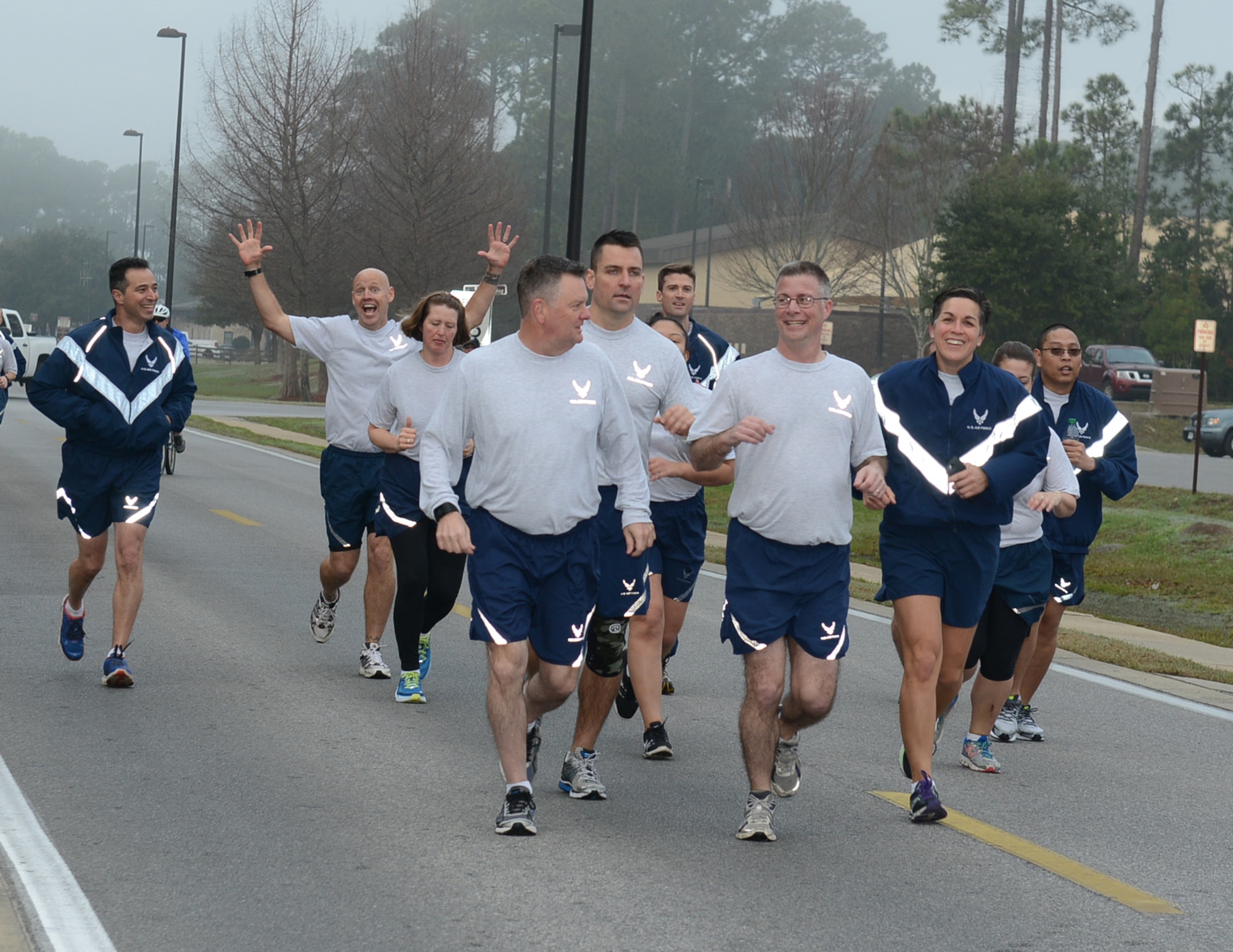 Lt. Gen. Brad Webb, commander of Air Force Special Operations Command, and Chief Master Sgt. Greg Smith, AFSOC command chief, run together during a 5K run at Hurlburt Field, Fla., Feb. 3, 2017. The AFSOC headquarters staff runs together once a month. (U.S. Air Force photo/Staff Sgt. Melanie Holochwost)
