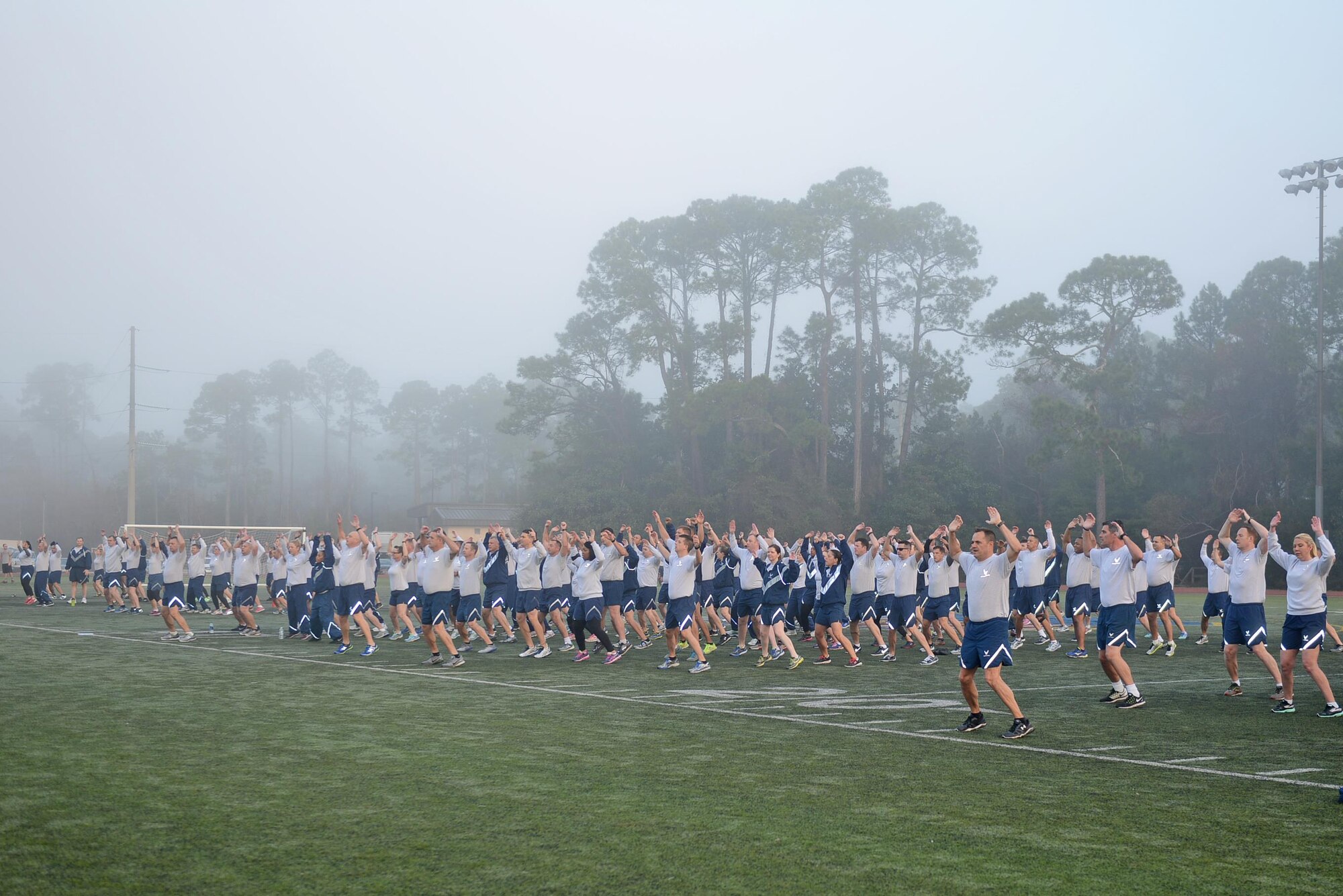 Air Commandos warm up for a 5K run at Hurlburt Field, Fla., Feb. 3, 2017. The Air Force Special Operations Command headquarters staff meets on the first Friday of every month for a command run. (U.S. Air Force photo/Staff Sgt. Melanie Holochwost)