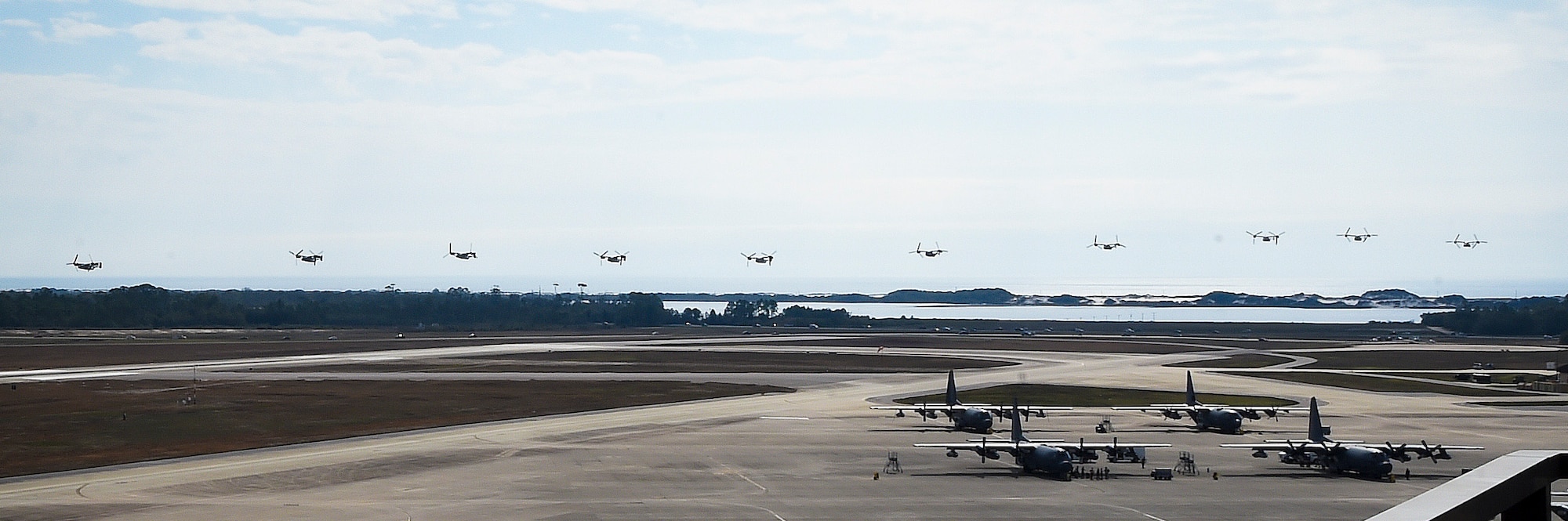 CV-22 Osprey tilt-rotor aircraft assigned to the 8th Special Operations Squadron, with Hurlburt Field, and 20th SOS, with Cannon Air Force Base, N.M., fly in formation over Hurlburt Field, Fla., Jan. 3, 2017. This training mission was the first time in Air Force history that ten CV-22s flew in formation simultaneously. (U.S. Air Force photo by Senior Airman Andrea Posey)