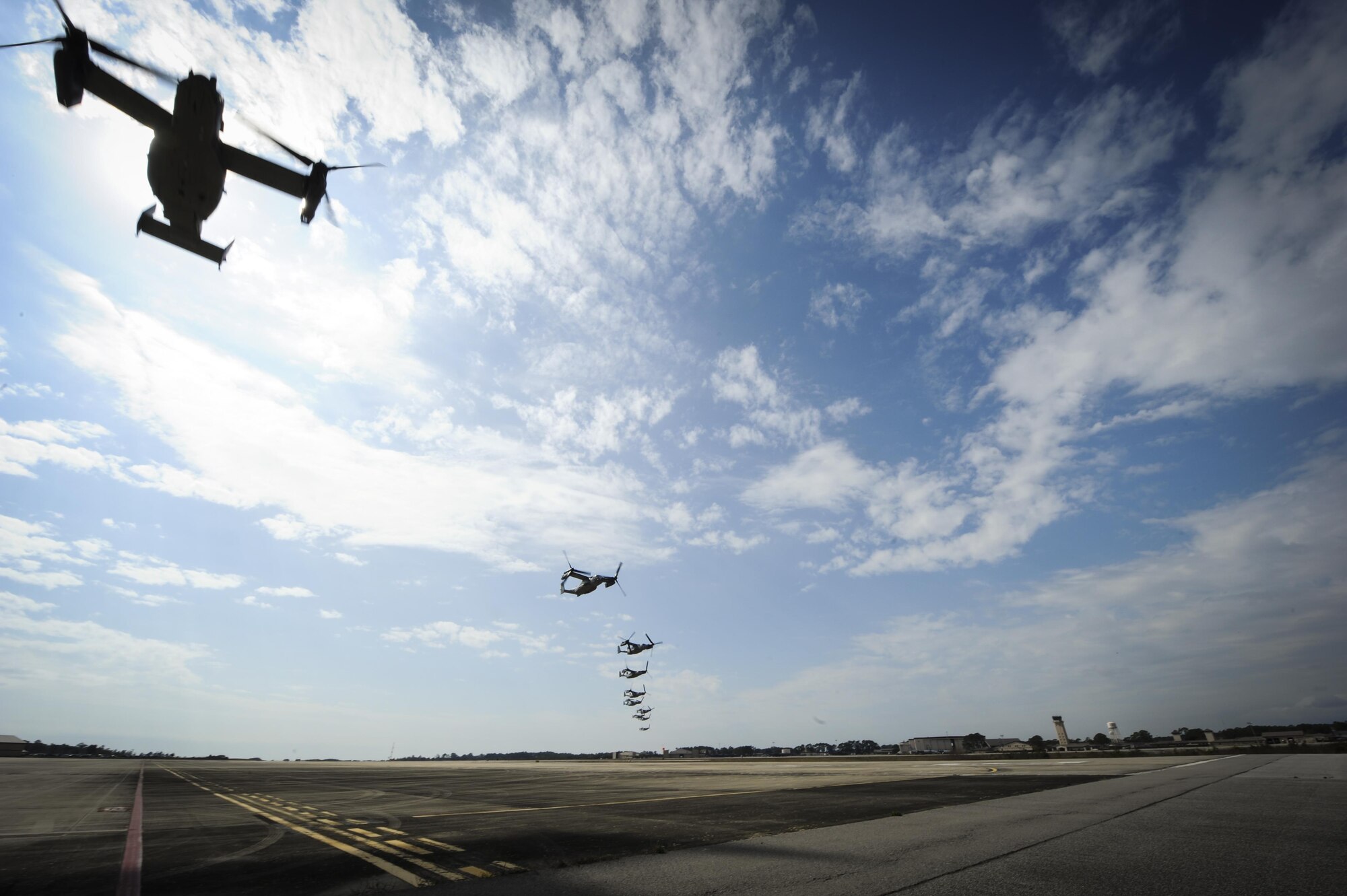 CV-22's Osprey tilt-rotor aircraft assigned to the 8th Special Operations Squadron, with Hurlburt Field, and 20th SOS, with Cannon Air Force Base, N.M., fly in formation over Hurlburt Field, Fla., Feb. 3, 2017. This training mission was the first time in Air Force history that ten CV-22's flew in formation simultaneously. (U.S. Air Force photo by Airman Dennis Spain)