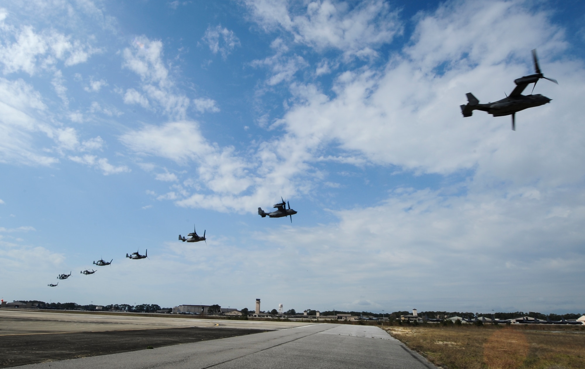 CV-22's Osprey tilt-rotor aircraft assigned to the 8th Special Operations Squadron, with Hurlburt Field, and 20th SOS, with Cannon Air Force Base, N.M., fly in formation over Hurlburt Field, Fla., Feb. 3, 2017. This training mission was the first time in Air Force history that ten CV-22's flew in formation simultaneously. (U.S. Air Force photo by Airman Dennis Spain)