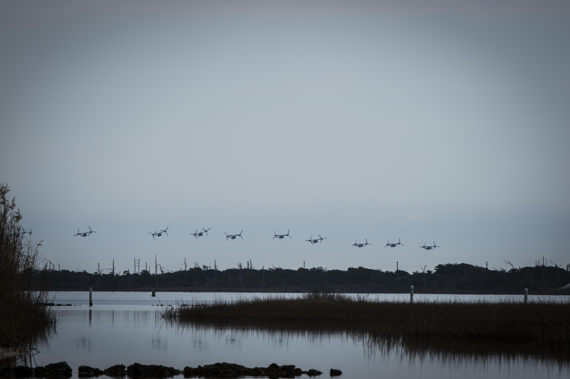 CV-22 Osprey tiltrotor aircraft assigned to the 8th Special Operations Squadron, with Hurlburt Field, and 20th SOS, with Cannon Air Force Base, N.M., fly in formation over Hurlburt Field, Fla., Feb. 3, 2017. This training mission was the first time in Air Force history that 10 CV-22s flew in formation simultaneously. (U.S. Air Force photo by Airman 1st Class Joseph Pick