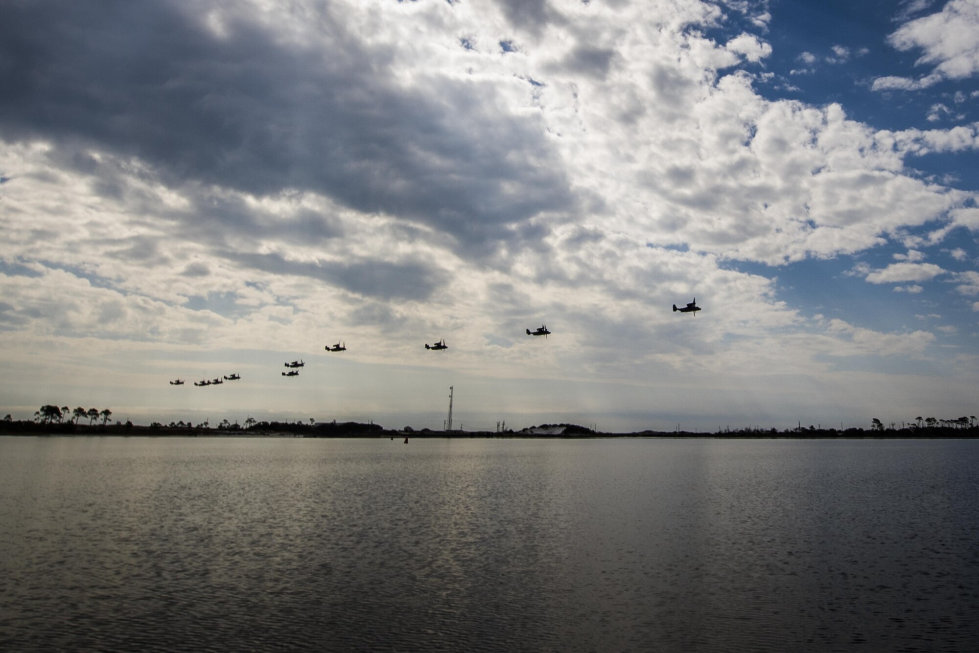 CV-22 Osprey tiltrotor aircraft assigned to the 8th Special Operations Squadron, with Hurlburt Field, and 20th SOS, with Cannon Air Force Base, N.M., fly in formation over Hurlburt Field, Fla., Feb. 3, 2017. This training mission was the first time in Air Force history that 10 CV-22s flew in formation simultaneously. (U.S. Air Force photo by Airman 1st Class Joseph Pick