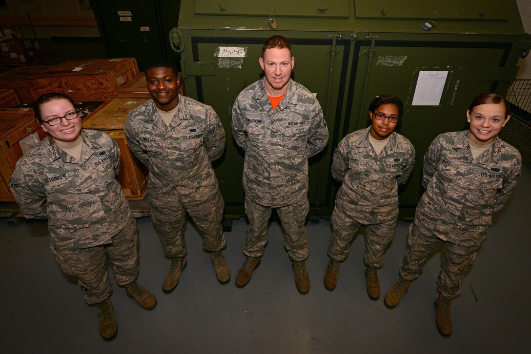 U.S. Airmen from the 20th Logistics Readiness Squadron stand in front of an F-16CM Fighting Falcon kit at Shaw Air Force Base, S.C., Feb. 3, 2017. The kit contains approximately $6.5 million worth of F-16 replacement parts, which can maintain the aircraft for up to 30 days in deployment and temporary duty situations. (U.S. Air Force photo by Airman 1st Class Kathryn R.C. Reaves)