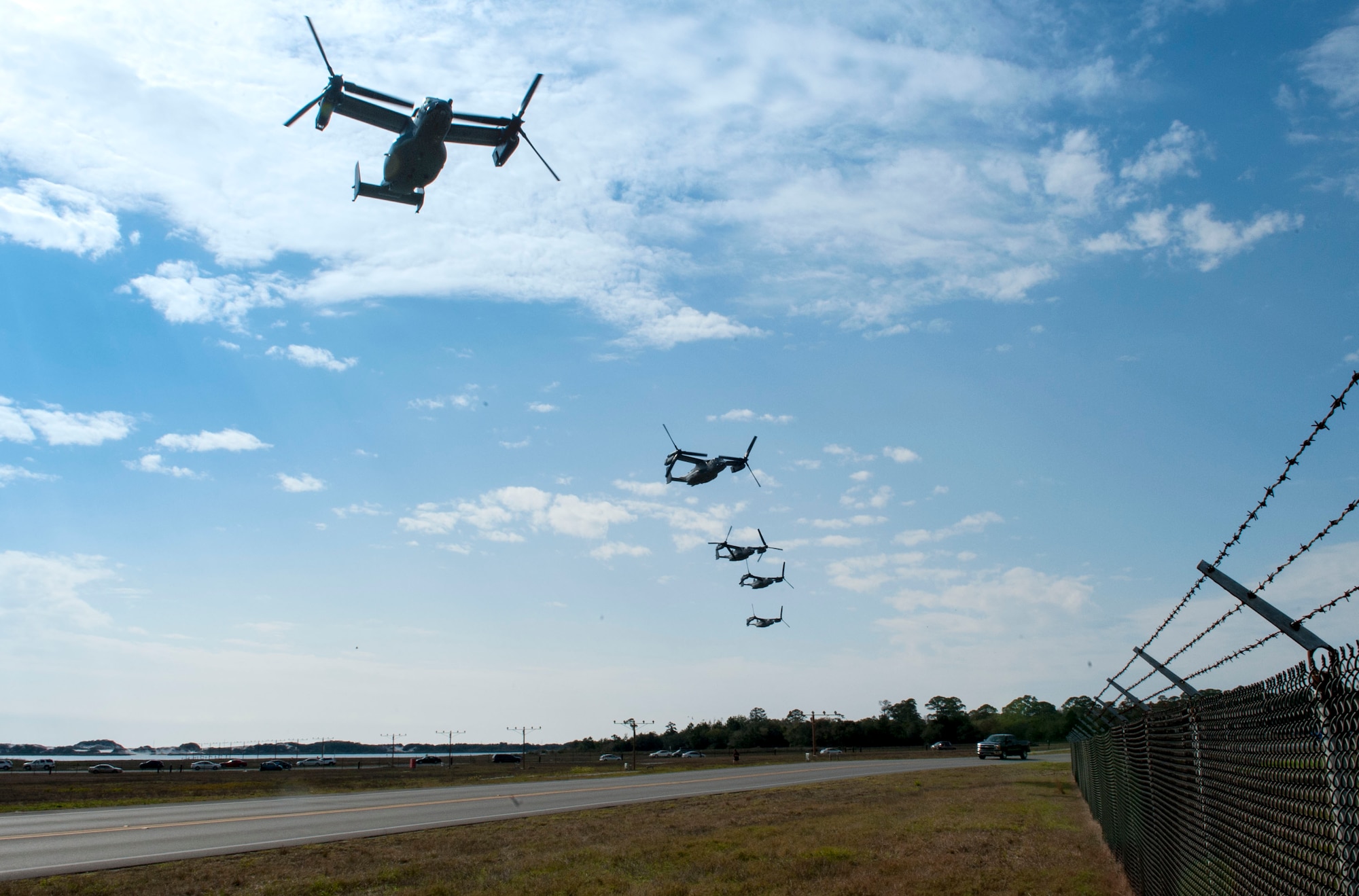 CV-22 Osprey tilt-rotor aircraft assigned to the 8th Special Operations Squadron, with Hurlburt Field, and 20th SOS, with Cannon Air Force Base, N.M., fly in formation over Hurlburt Field, Fla., Jan. 3, 2017. This training mission was the first time in Air Force history that 10 CV-22s flew in formation simultaneously. (U.S. Air Force photo by Senior Airman Krystal M. Garrett)