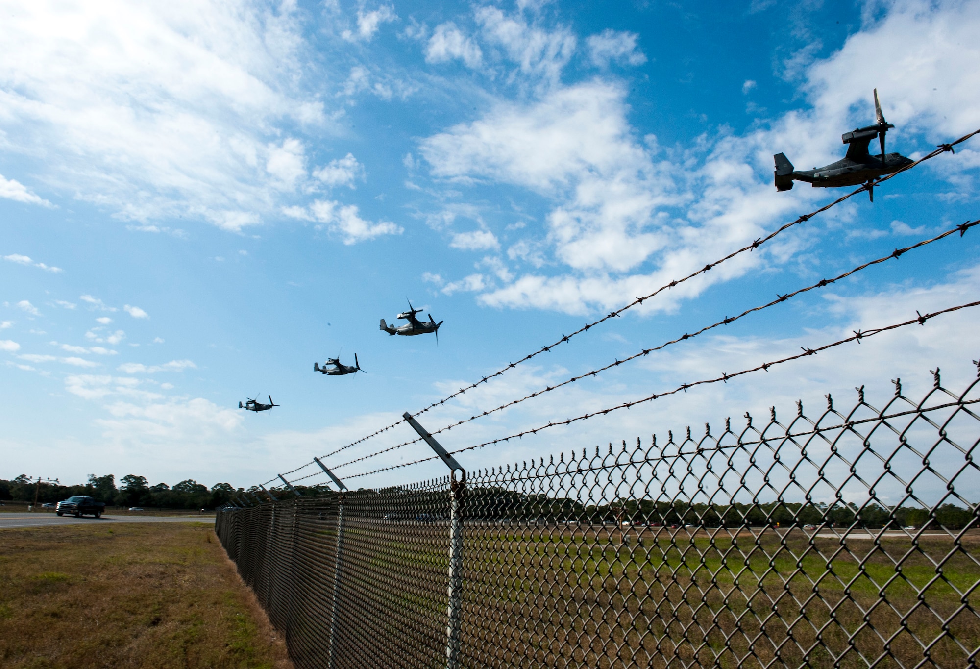 CV-22 Osprey tilt-rotor aircraft assigned to the 8th Special Operations Squadron, with Hurlburt Field, and 20th SOS, with Cannon Air Force Base, N.M., fly in formation over Hurlburt Field, Fla., Jan. 3, 2017. This training mission was the first time in Air Force history that 10 CV-22s flew in formation simultaneously. (U.S. Air Force photo by Senior Airman Krystal M. Garrett)