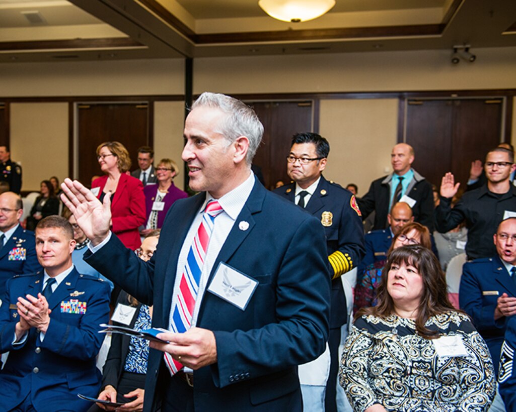 Incoming honorary commander’s take the honorary commander’s oath during a ceremony at Travis Air Force Base, Calif., Feb. 2, 2017. The honorary commander’s program was developed to encourage and exchange ideas, experiences, and friendships between key members of the civilian community and the Travis AFB military community. (U.S. Air Force photo/Louis Briscese)