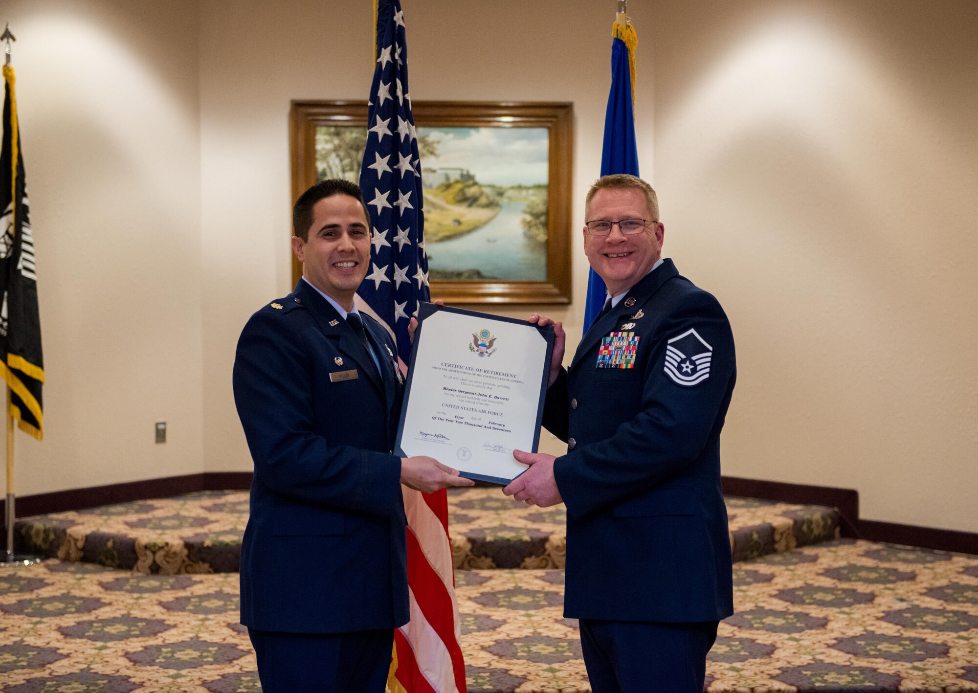 Master Sgt. John Barrett, 934th Force Support Squadron, receives his retirement certificate Jan. 7.