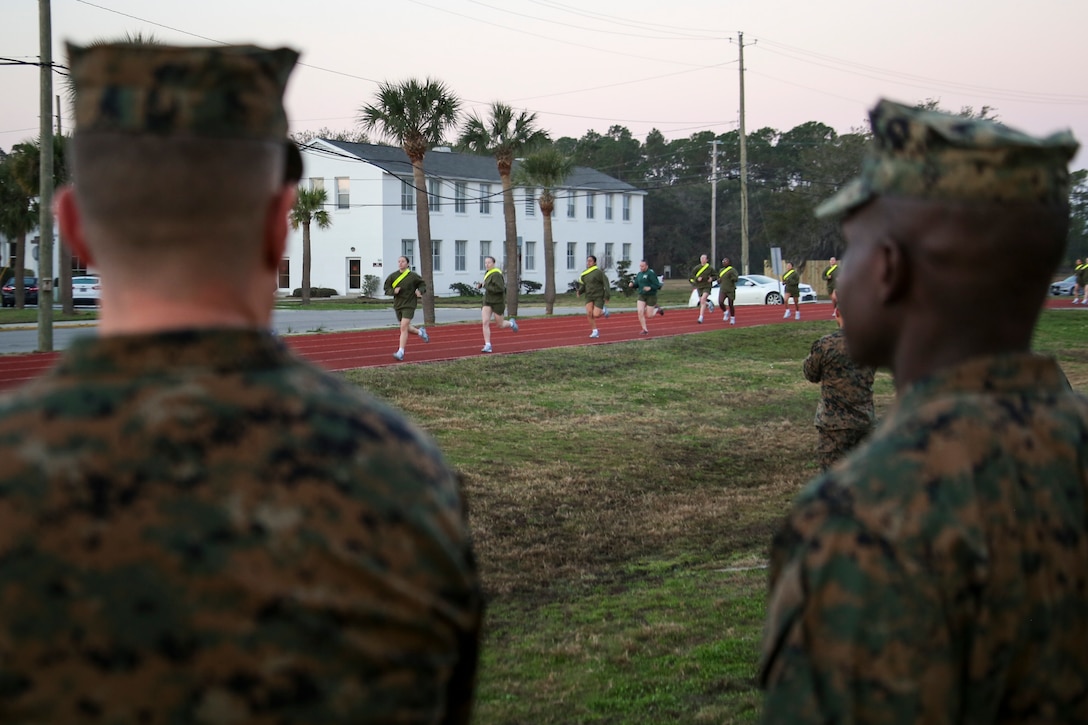 Colonel Jeffrey C. Smitherman, commanding officer of 6th Marine Corps District (6th MCD), left, and Sgt. Maj. Anthony N. Page, sergeant major of 6th MCD, observes an Initial Strength Test (IST) during the 8412 Slating Conference aboard Marine Corps Recruit Depot Parris Island, South Carolina, Feb. 3, 2017. The Slating Conference brings the recruiting command together to discuss the movement of their Marines across recruiting stations. A Marine holding the military occupational specialty of 8412 is known as a career recruiter. These recruiters use the IST to assist them in the training and mentoring of future Marines.  (U.S. Marine Corps photo by Lance Cpl. Jack A. E. Rigsby/Released)