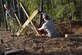 Team Shaw members work together to take apart a defensive fighting position during a beautification project at Shaw Air Force Base, S.C., Feb. 1, 2017. The DFP was used in exercises for personnel deploying downrange, giving them the training to take cover in a shelter and the ability to shoot the enemy. (U.S. Air Force photo by Airman 1st Class BrieAnna Stillman)
