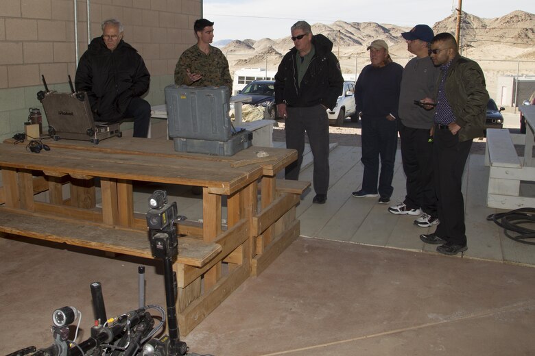 Sgt. Brandon White, explosive ordnance disposal (EOD) technician, Combat Center EOD, demonstrates using remote controlled bomb disposal robots to members of the Drug Enforcement Administration Citizens’ Academy Alumni Association aboard Marine Corps Air Ground Combat Center, Twentynine Palms, Calif., Jan. 26, 2017. (U.S. Marine Corps photo by Cpl. Connor Hancock)