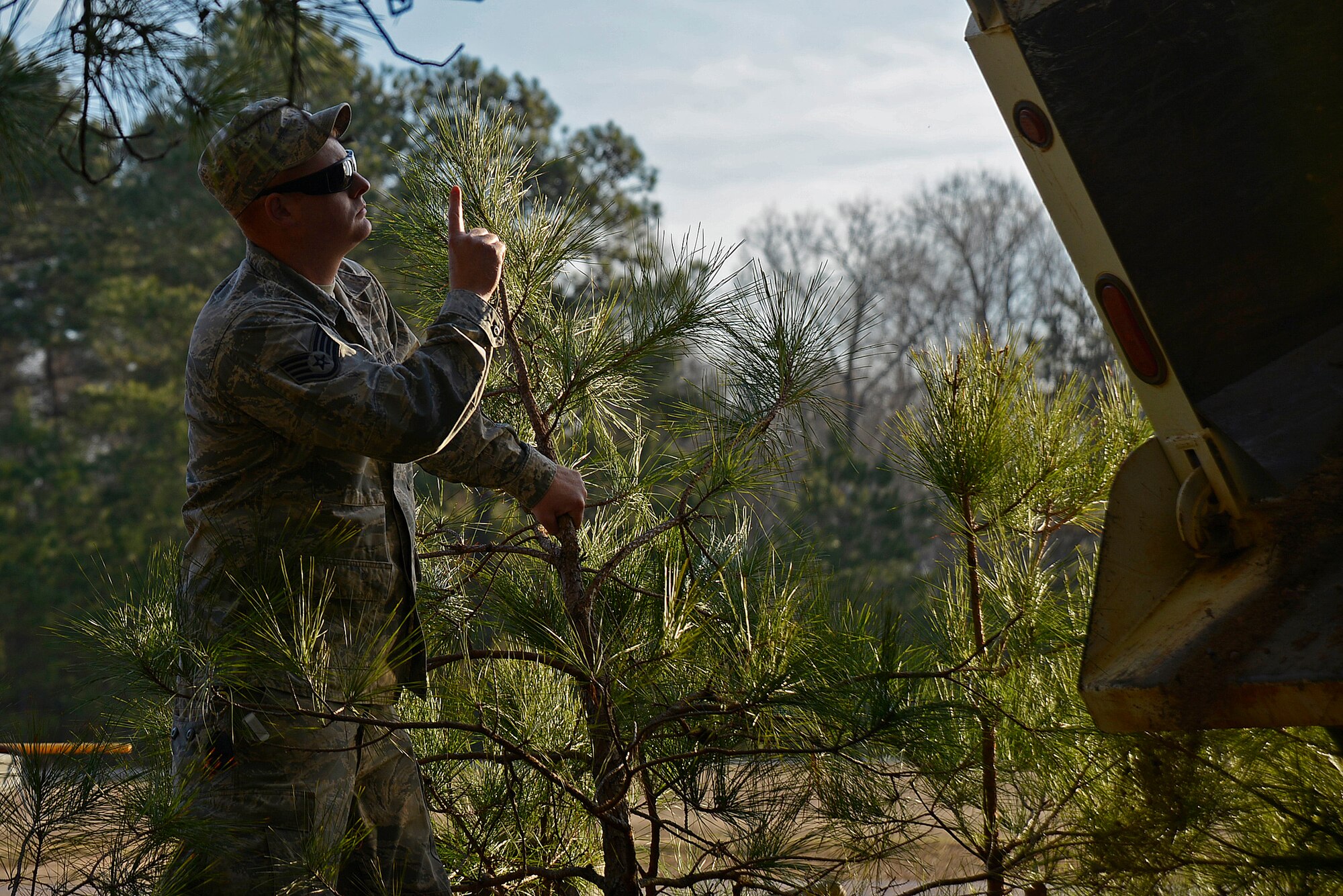 U.S. Air Force Staff Sgt. Sonny Tanner, 20th Civil Engineer Squadron heavy equipment operator, directs an Airman backing up a truck at Shaw Air Force Base, S.C., Feb. 1, 2017. Heavy equipment operators, known as Dirt Boyz, regularly use vehicles such as dump trucks for contruction projects around base. (U.S. Air Force photo by Airman 1st Class BrieAnna Stillman)