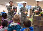 From left, Staff Sgt. Soohwa Ono, Senior Airman Vanessa Rivas, and Capt. Daniel Chartrand promote pediatric oral hygiene Feb. 2 at the Kelly Child Development Center. Throughout February, the 59th Dental Group is holding outreach events at the Joint Base San Antonio-Lackland Elementary School and child development centers. Ono and Rivas are 59th DG dental technicians; Chartrand is a 59th DG dentist. (U.S. Air Force photo/Staff Sgt. Kevin Iinuma)