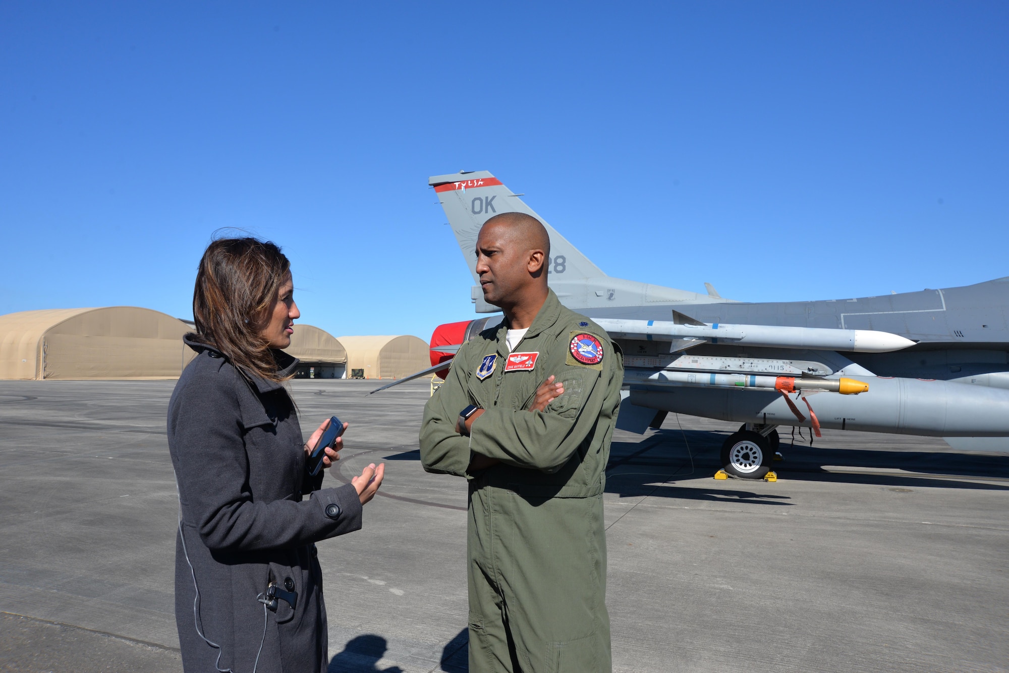Texas Civil Air Patrol Wing Maj. Ken Wiggins talks with Houston Chronicle business reporter Andrea Rumbaugh about CAP-oriented support during a Super Bowl LI aerospace-security related media day Jan. 31 at Ellington Field Joint Reserve Base, Houston, Texas. Representatives from several agencies came together to speak about their roles in helping support air defense during Super Bowl LI Feb. 5. (Photo released by Mary McHale)