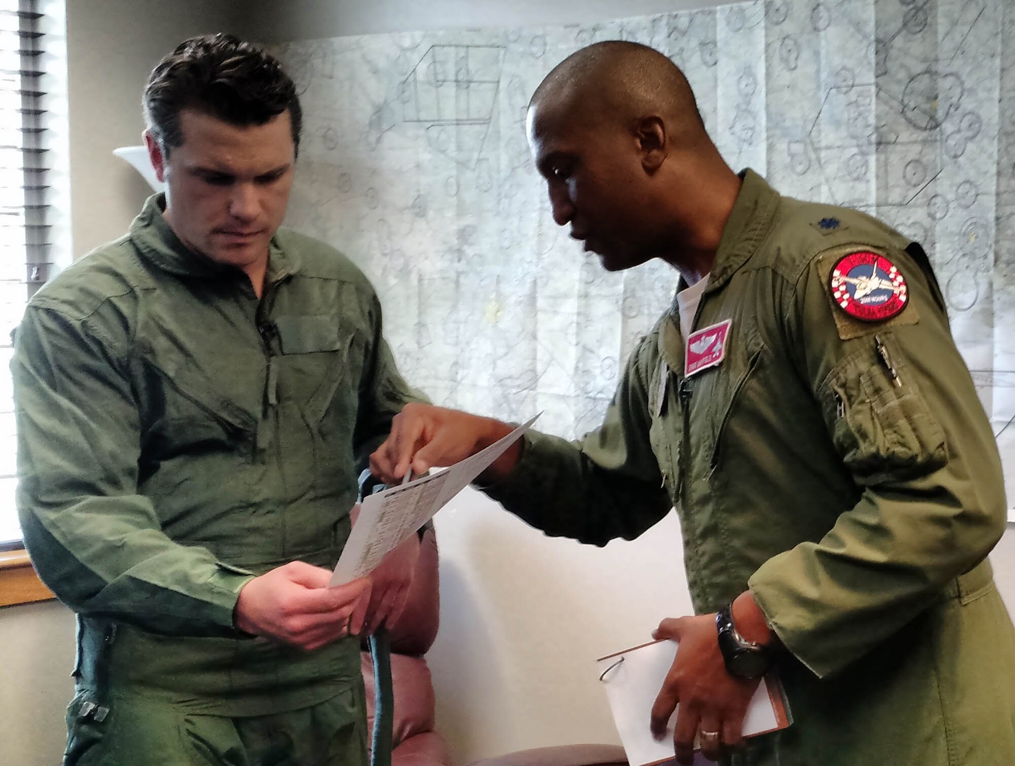 Peter Hegseth, Fox & Friends television news contributor, gets a mission brief from Lt. Col. Ernie Mayfield, Director of Operations, 138th Fighter Wing, Det. 1, prior to an aerospace defense familiarization flight Feb. 1 at Ellington Field Joint Reserve Base, Houston Texas. Hegseth flew with the unit as part of a Continental Aerospace Defense Region communications outreach plan to help enhance public knowledge about temporary flight restrictions during high-profile events such as Super Bowl LI. (Photo released by Mary McHale)