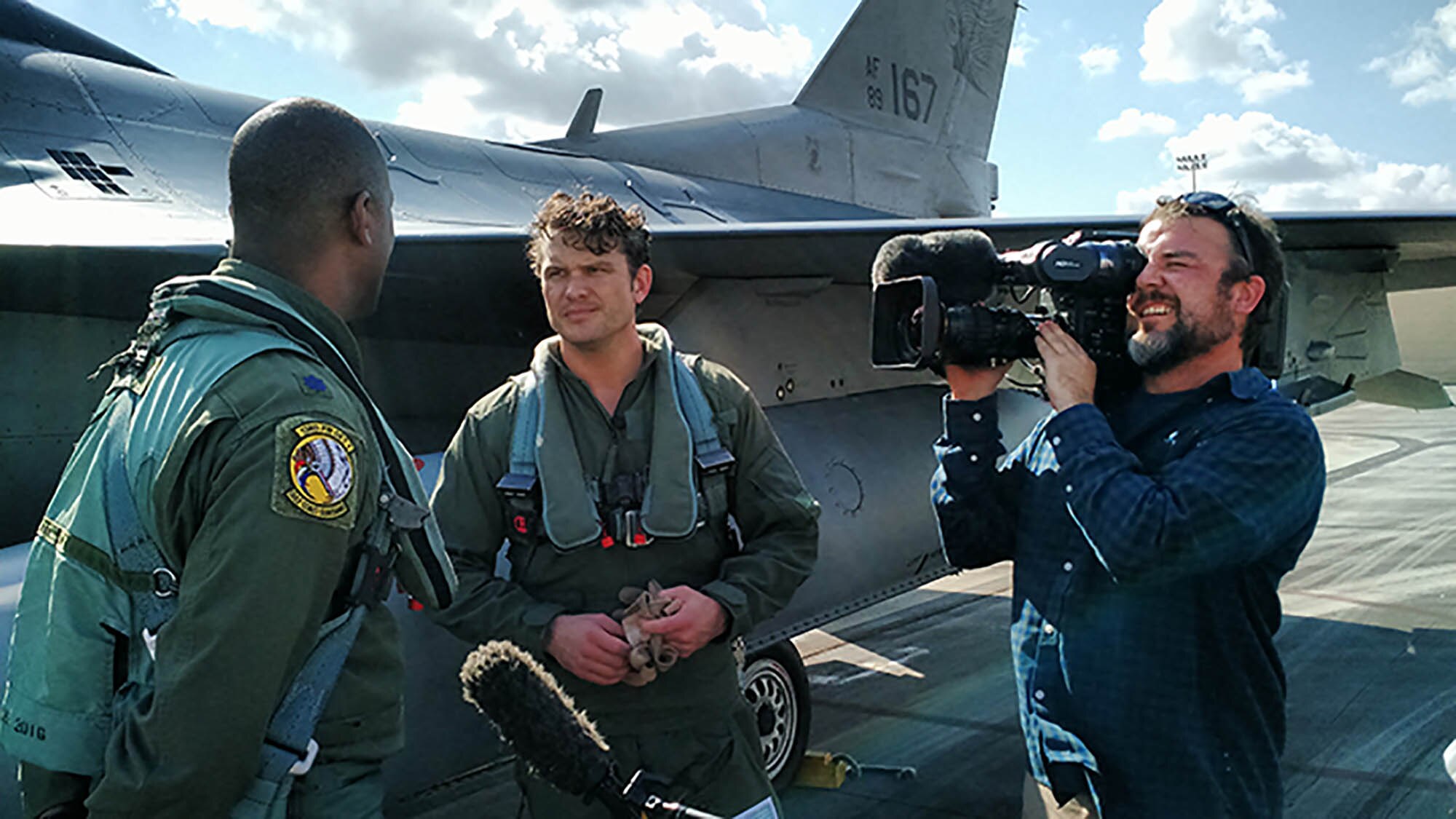 Lt. Col. Ernie Mayfield, Director of Operations, 138th Fighter Wing, Det. 1, talks with Peter Hegseth, Fox & Friends television news, following his aerospace defense familiarization flight Feb. 1. at Ellington Field Joint Reserve Base, Houston Texas. Hegseth flew with the unit as part of a Continental Aersospace Defense Region communications outreach plan to help enhance public knowledge about temporary flight restrictions during high-profile events such as Super Bowl LI. (Photo released by Mary McHale)