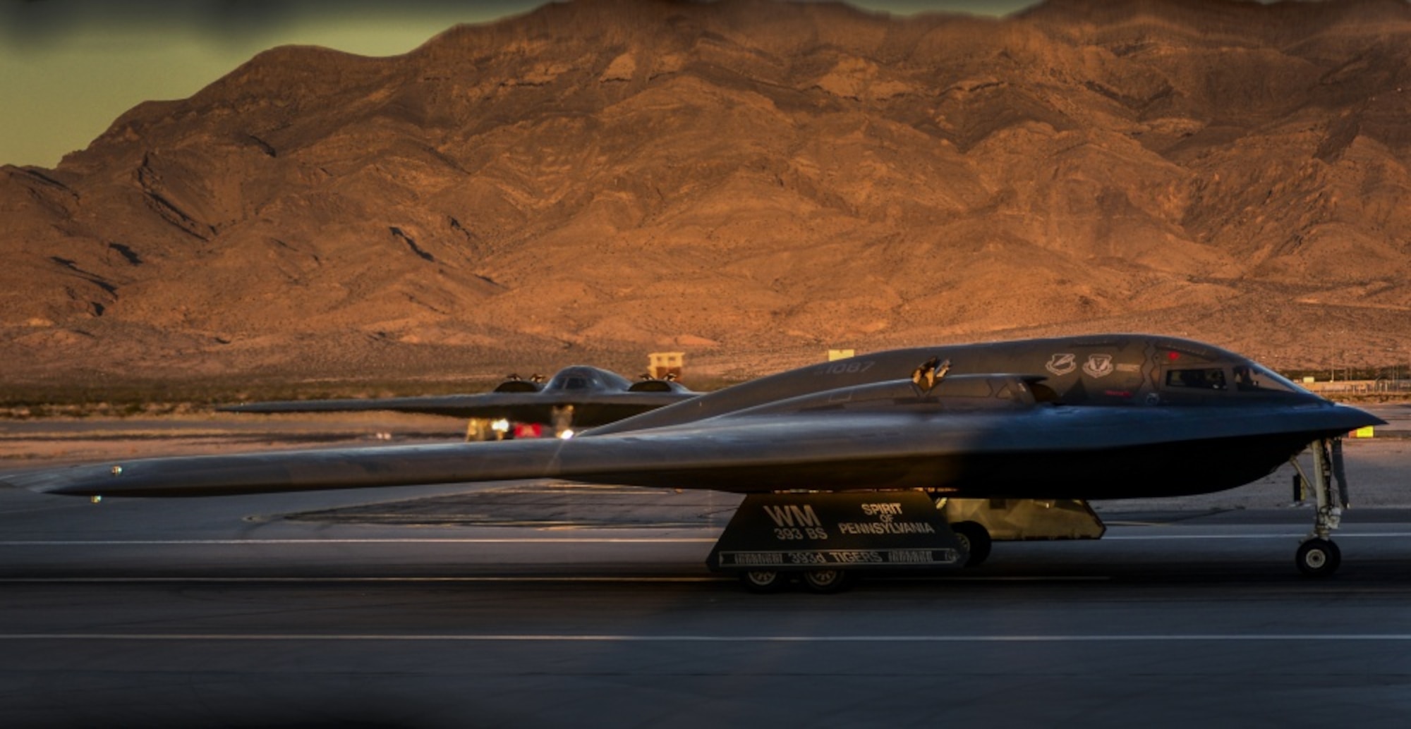 Two B-2 Sprit stealth bombers assigned to the 509th Bomb Wing, Whiteman Air Force Base, Missouri, taxi down the runway as they prepare to takeoff during Deliberate Strike Night at Nellis Air Force Base, Nevada, June 16, 2016. Two B-2s departed Whiteman Air Force Base, Missouri for a transatlantic flight to Libya on Jan. 18 in what would become the B-2’s first combat mission since Operation Odyssey Dawn in 2011. (U.S. Air Force photo by Airman 1st Class Kevin Tanenbaum)