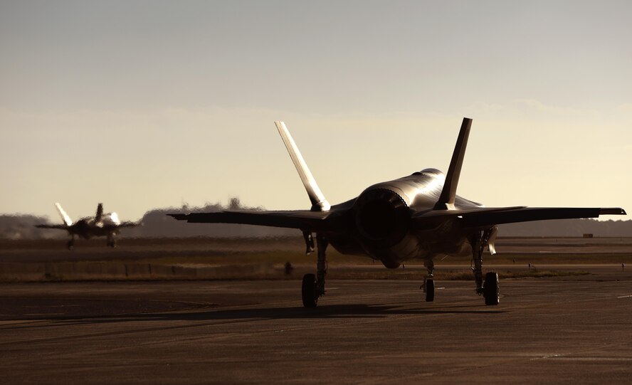U.S. Navy Lt. Cmdr. Charles Escher, Strike Fighter Squadron (VFA-101) operations officer, follows Col. Lance Pilch, 33rd Fighter Wing commander, prior to flying a check ride sortie Dec. 6, 2016, at Eglin Air Force Base, Florida. For only the second time at Eglin AFB, a Naval Aviator has been selected to dual qualify in the U.S. Navy’s F-35C and the Air Force’s F-35A. Escher plans to use what he learns from his experience with the 33 FW to help the F-35 enterprise grow. He looks to join a group of test pilots at Edwards AFB, California, where he will have the opportunity to be the Navy’s voice for the aircraft weapons and vehicle system development. (U.S. Air Force photo/ Staff Sgt. Peter Thompson)