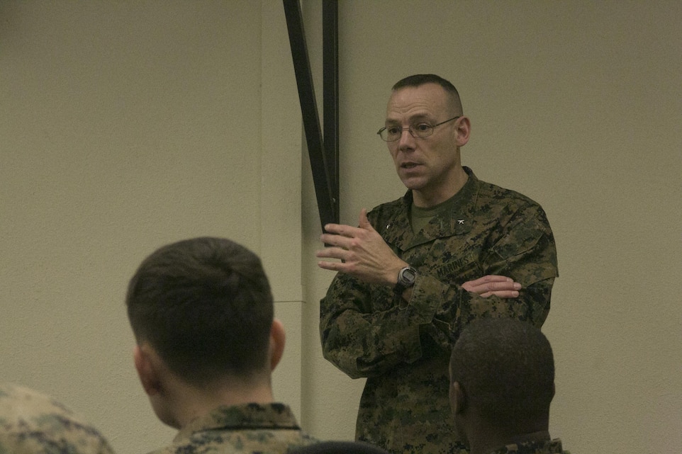 Brig. Gen. Ryan Heritage, deputy director of operations, U.S. Cyber Command, talks with Marine Corps Communication-Electronics School students aboard Marine Corps Air Ground Combat Center Twentynine Palms, Calif., Jan. 31, 2017. (Marine Corps photo by Cpl. Thomas Mudd)