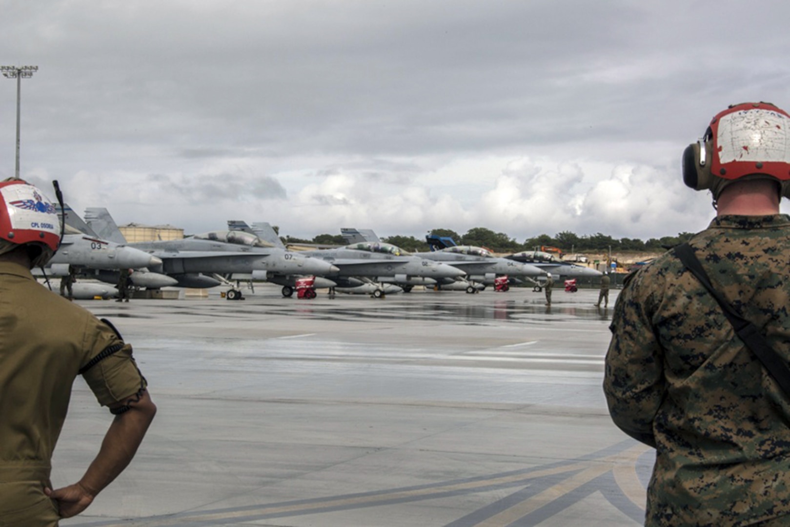 U.S. Marines with Marine All Weather Fighter Attack Squadron (VMFA) 225 wait to direct F/A-18D Hornets during exercise Cope North at Andersen Air Force Base, Feb. 3, 2017.  Marines trained with the Royal Australian Air Force and Japan Air Self-Defense Force supporting theater security, focusing on dissimilar air combat training and large force employment. 