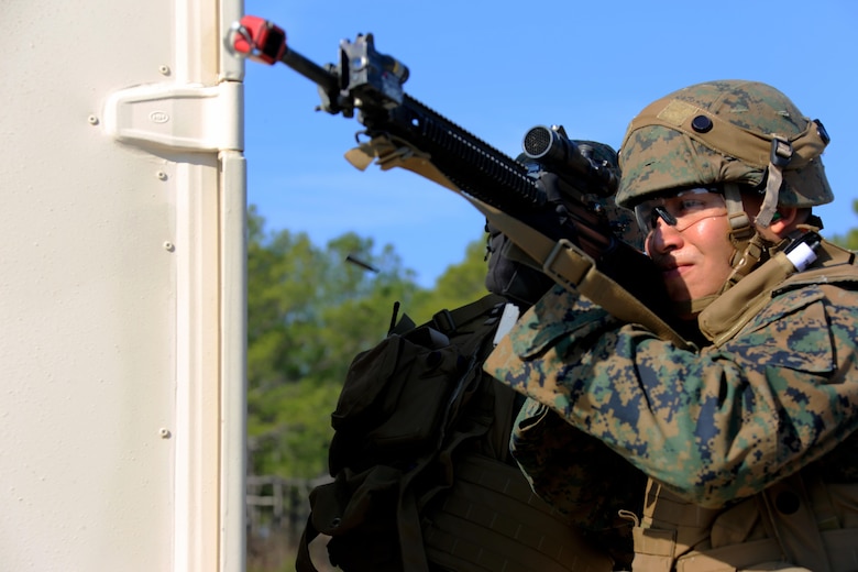 A Marine lays cover fire during Military Operations in Urban Terrain training aboard Marine Corps Outlying Field Atlantic, N.C., Feb. 2, 2017. Nearly 40 Marines with supporting personnel participated in the weeklong training that simulated hostile takeovers and how to overcome unexpected situations with small unit leadership. “This [training] gave small unit leaders the chance to train the Marines to help them become more in-tune to the life or death situations they may encounter,” said Cpl. Christian Leishman, a squad leader for the exercise. The Marine is assigned to Marine Wing Support Squadron 271, Marine Aircraft Group 14, 2nd Marine Aircraft Wing. (U.S. Marine Corps photo by Cpl. Jason Jimenez/ Released)