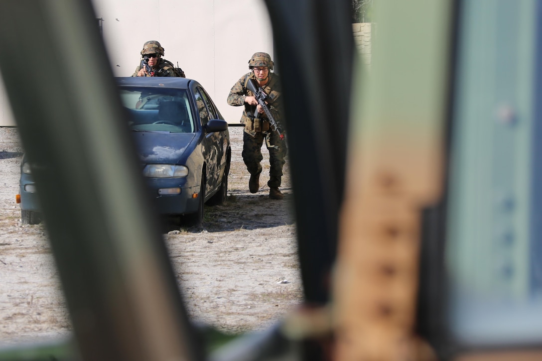 Marines maneuver around a vehicle during Military Operations in Urban Terrain training aboard Marine Corps Outlying Field Atlantic, N.C., Feb. 2, 2017. Nearly 40 Marines with supporting personnel participated in the weeklong training that simulated hostile takeovers and how to overcome unexpected situations with small unit leadership. “This is for them to open their eyes to what could be expected of them when conducting these types of operations,” said 1st Lt. Charles Sieber, a combat engineer officer, assigned to Marine Wing Support Squadron 271, Marine Aircraft Group 14, 2nd Marine Aircraft Wing. (U.S. Marine Corps photo by Cpl. Jason Jimenez/ Released)