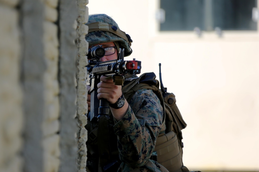 Pfc. Jacob Maze peers through his scope during Marine Wing Support Squadron 271’s Military Operations in Urban Terrain training aboard Marine Corps Outlying Field Atlantic, N.C., Feb. 2, 2017. With corporal being the highest rank participating in the building-clearing, small unit leadership was tested with constantly shifting leadership positions. “My end goal is to ensure any of my Marines are able to take my place if the situation arises,” said Cpl. Christian Leishman, a squad leader for the exercise. Maze is an engineer equipment operator with MWSS-271, Marine Aircraft Group 14, 2nd Marine Aircraft Wing. (U.S. Marine Corps photo by Cpl. Jason Jimenez/ Released)