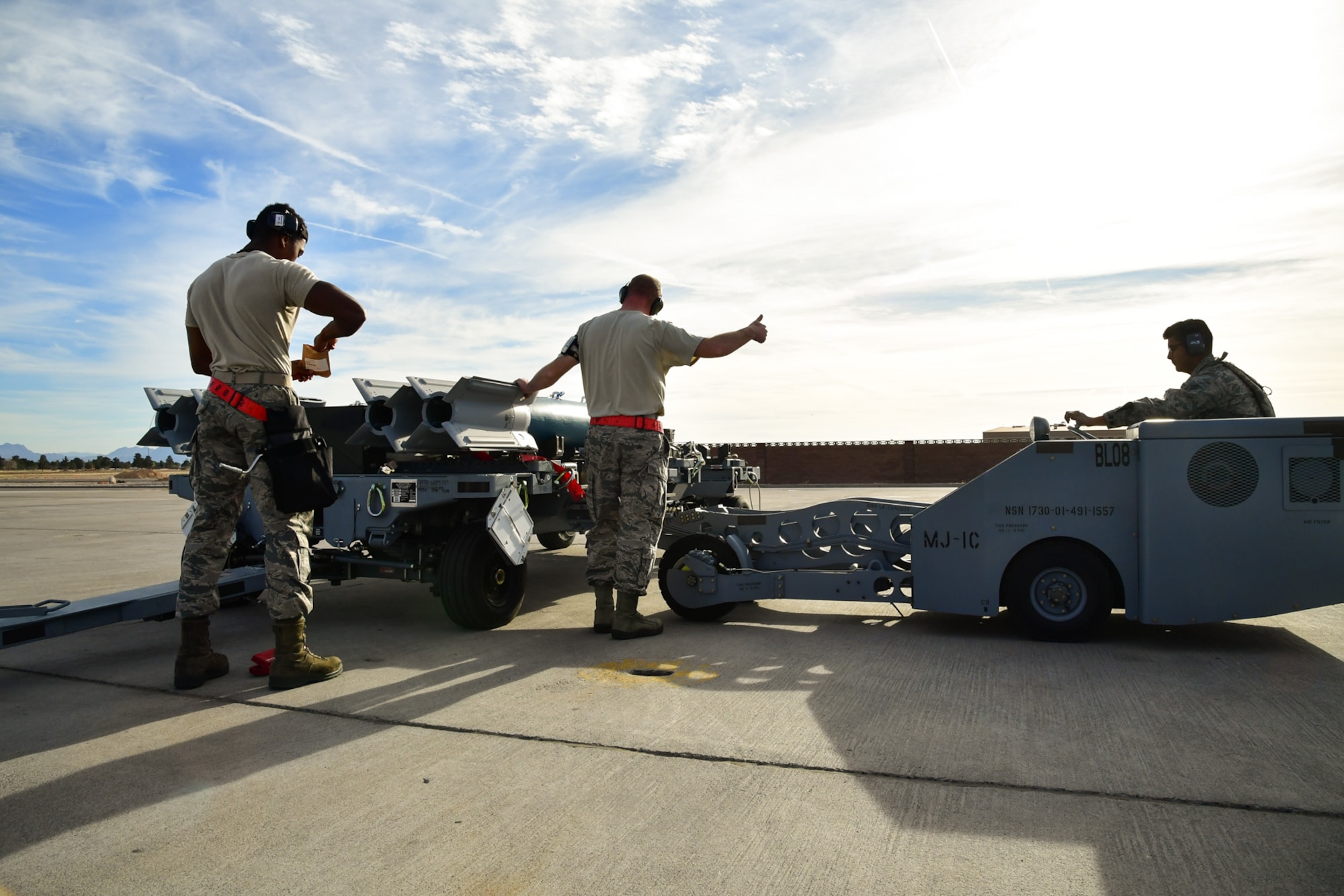 An Air Force weapons load crew assigned to the 34th Aircraft Maintenance Unit, Hill Air Force Base, Utah, prepares to load a GBU-12 into an F-35A Lightning II aircraft at Nellis AFB, Nevada, Feb. 1. Airmen from the 388th and 419th Fighter Wings at Hill are participating in Red Flag 17-01. Red Flag is the U.S. Air Force’s premier air-to-air combat training exercise. This is the first F-35A deployment to Red Flag since the Air Force declared the jet combat ready in August 2016. (U.S. Air Force photo/R. Nial Bradshaw)