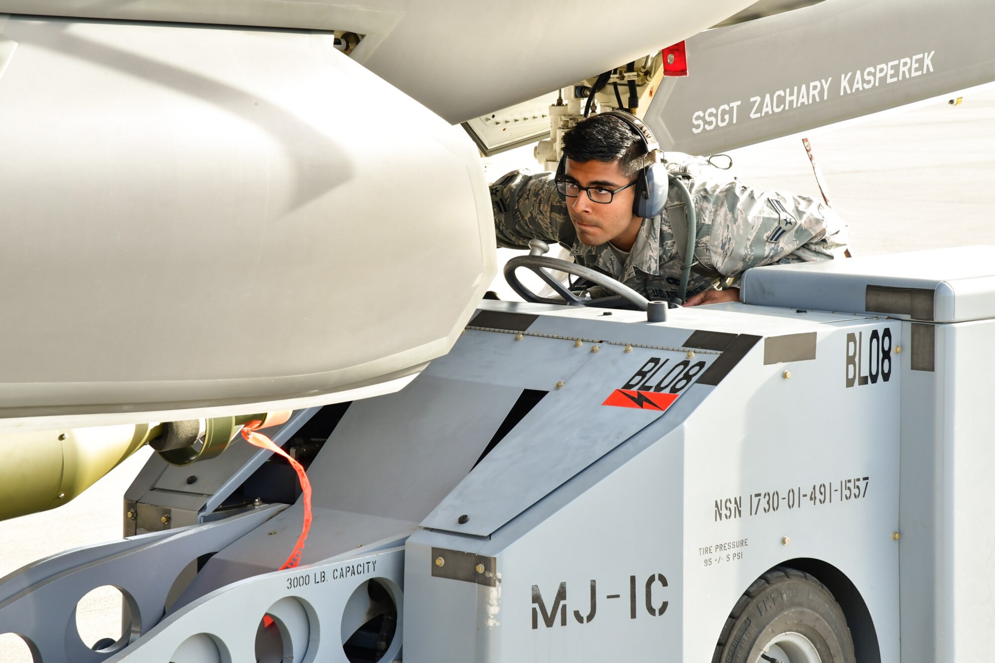 Airman 1st Class Santos Vargas, 34th Aircraft Maintenance Unit at Hill Air Force Base, Utah, operates a jammer while loading a GBU-12 into an F-35A aircraft during Red Flag 17-01 at Nellis AFB, Nevada, Feb. 1, 2017. (U.S. Air Force photo/R. Nial Bradshaw)