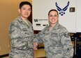 Col. Jerry Gonzalez, Air Education and Training Command Inspector General Chief of Inspection Division, gives a coin to Staff Sgt. Dawn Edwards, 14th Medical Operations Squadron Aerospace Operational Physiology flight chief, Jan. 30, 2017, in recognition of her efforts during the Unit Effectiveness Inspection at Columbus Air Force Base, Mississippi. The Columbus AFB UEI ran from Jan. 23-30 where AETC IG inspected the Major Graded Areas of how the wing executes the mission, manages resources, improves the unit, and leads people.  (U.S. Air Force photo by Elizabeth Owens)