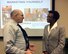 Mark Horning, Airman and Family Readiness Center Director, speaks to Patricia Cole, U.S. Navy retired captain, before the Marketing Yourself for a Second Career brief Jan. 17, 2017, at Columbus Air Force Base, Mississippi. The AFRC should be the first stop for information on the surrounding area such as child care vouchers and employment opportunities. Programs available include monthly socials for deployed and TDY members’ families, financial planning, and Falcon Loans through the Air Force Aid Society. Other noteworthy benefits include transition assistance, survivor benefit plans, and relocation information. Additionally, in partnership with East Mississippi Community College workshop, classes are offered free of charge in a variety of career fields. For additional information, visit online at columbusafbliving.com or call 434-2790. (U.S. Air Force photo by Richard Johnson)   