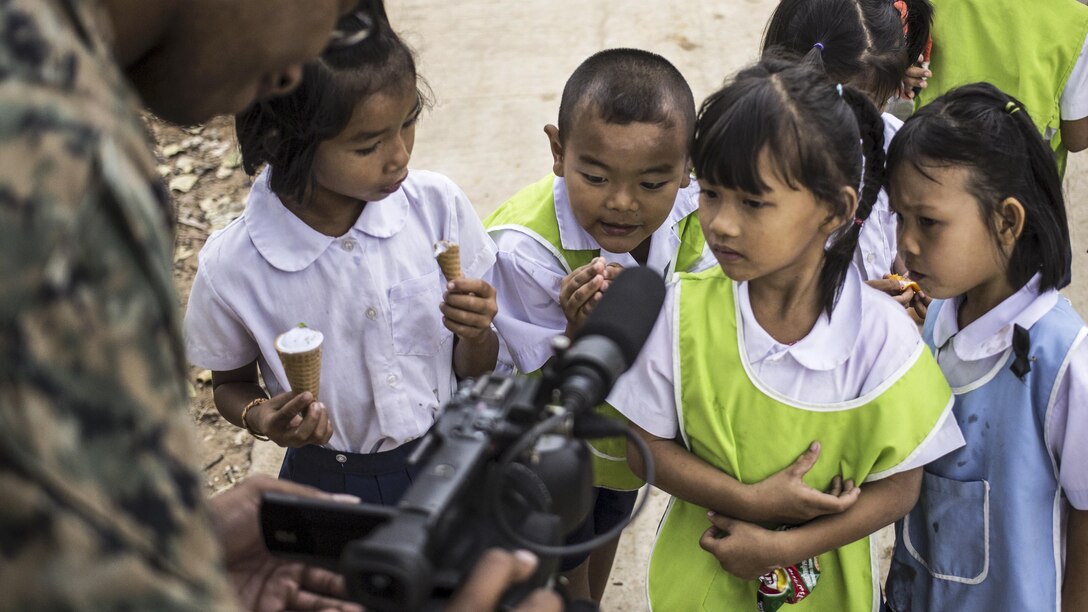 Marine Corps Lance Cpl. Justin Dixon records video of children at the Ban Non Lueam School during exercise Cobra Gold in Korat, Thailand, Feb. 2, 2017. Cobra Gold is the largest annual multilateral exercise in Asia. Marine Corps photo by Staff Sgt. Nathan O. Sotelo