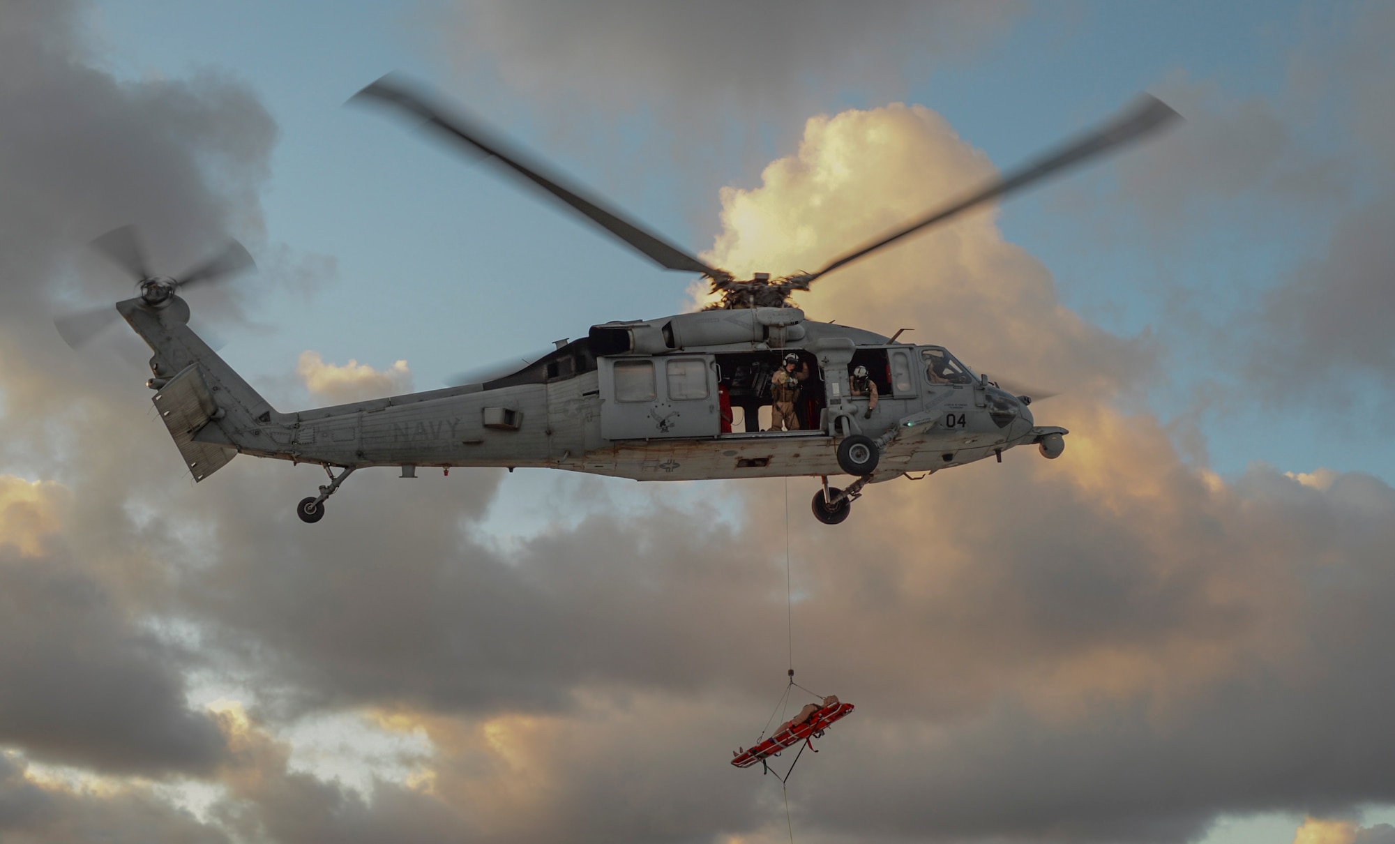 An MH-60S Sea Hawk helicopter assigned to the Island Knights of Helicopter Sea Combat Squadron (HSC) 25 conducts a training flight June 15, 2016, at Andersen Air Force Base, Guam. HSC-25 maintains a 24-hour search and rescue and medical evacuation alert posture, directly supporting the U.S. Coast Guard, Sector Guam and Joint Region Marianas. HSC-25 ensures maritime peace and security in the U.S. 7th Fleet area of responsibility. (U.S. Air Force photo by Tech. Sgt. Richard Ebensberger)