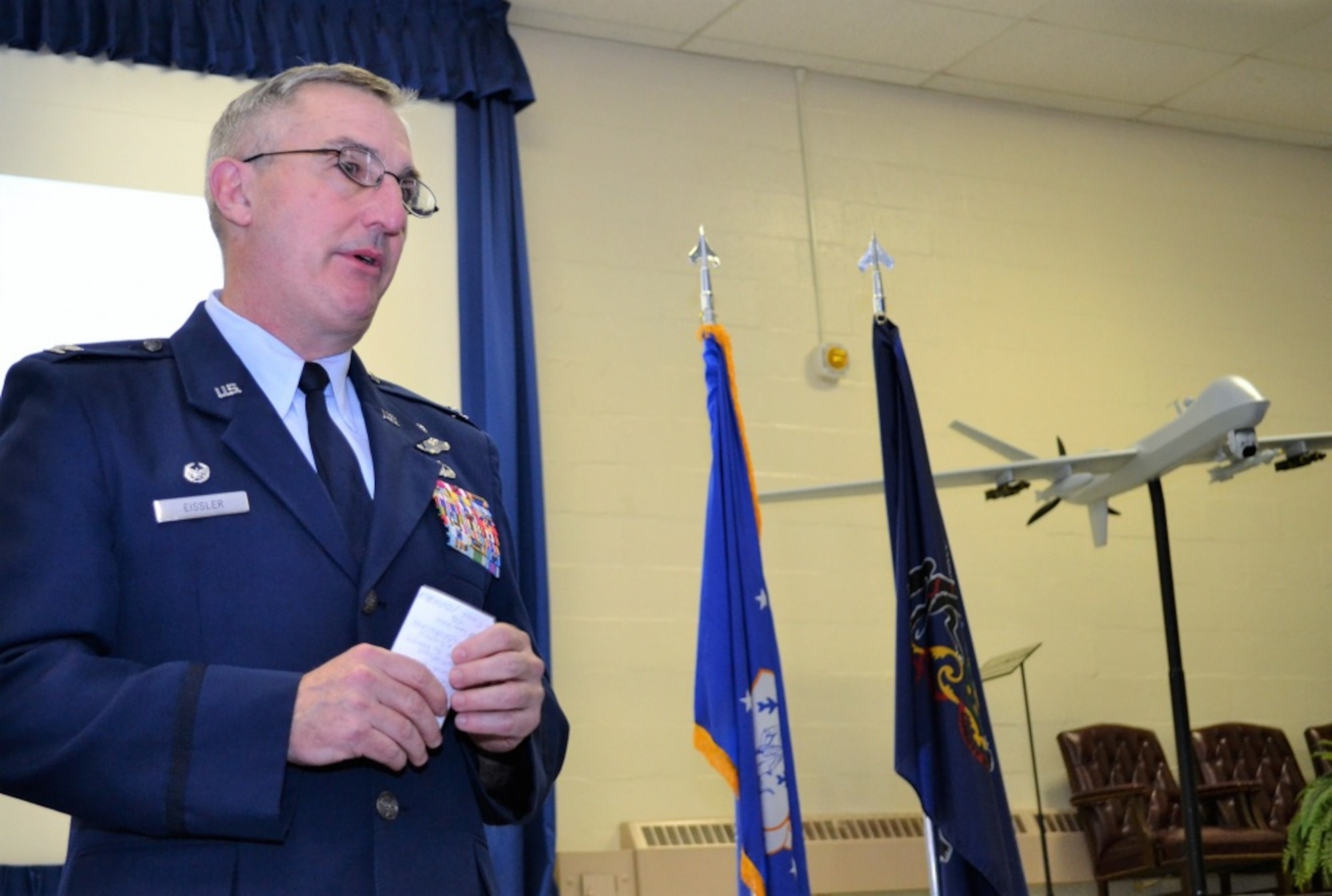 Commander of the 111th Attack Wing Col. Howard Eissler addresses the audience during a change of command ceremony at Horsham Air Guard Station, Pa., Jan. 7, 2017. Eissler commands an Air National Guard wing that includes RED HORSE, remotely-piloted aircraft and cyberspace operations units. (U.S. Air National Guard photo by Tech. Sgt. Andria Allmond)