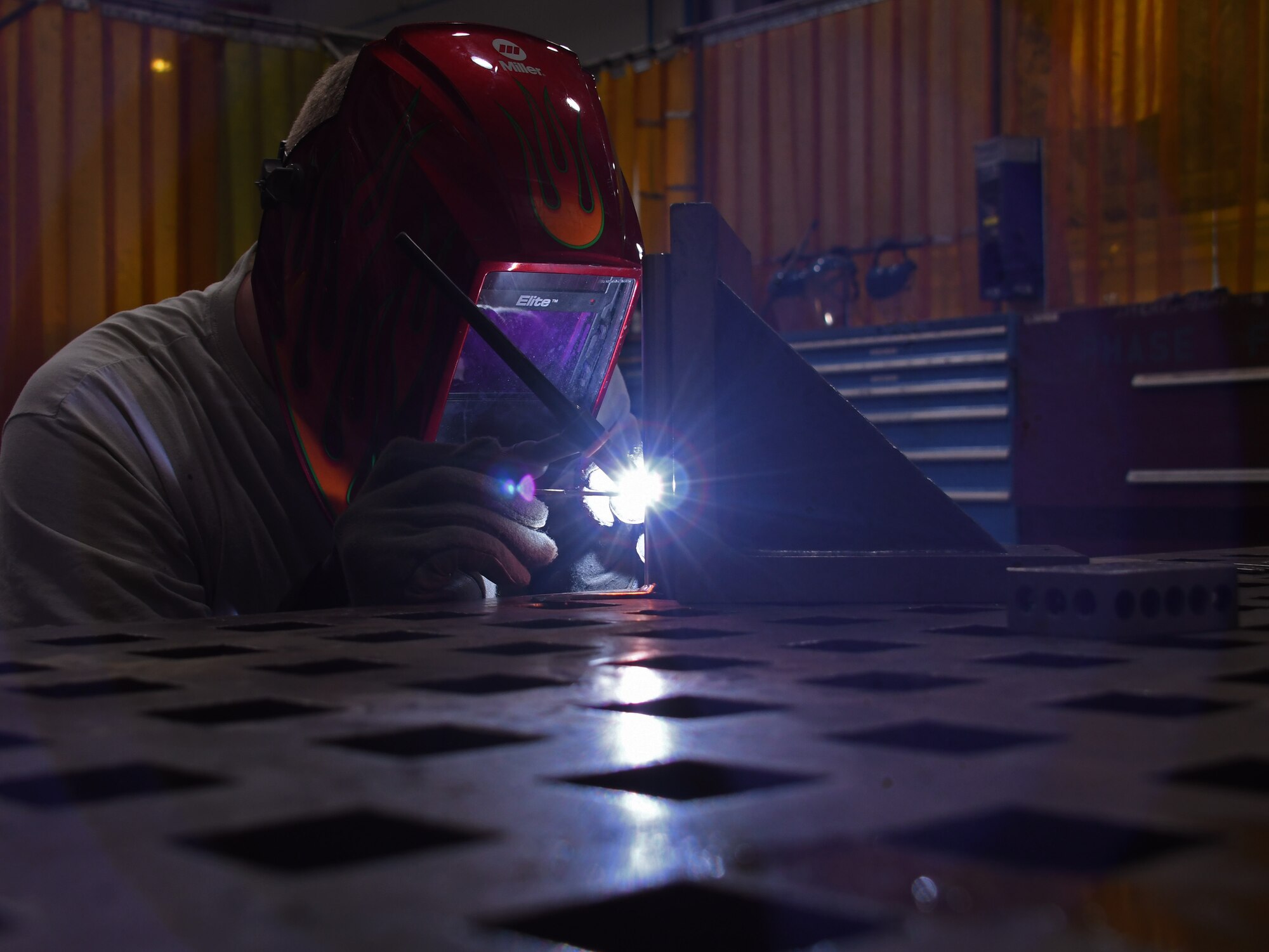U.S. Air Force Staff Sgt. Andrew Walker, a fabrication flight metals technician with the 379th Expeditionary Maintenance Squadron, welds components together at Al Udeid Air Base, Qatar, Feb. 2, 2017. Walker was creating a spring tensioning tool that was commissioned by the U.S. Navy. (U.S. Air Force photo by Senior Airman Miles Wilson)