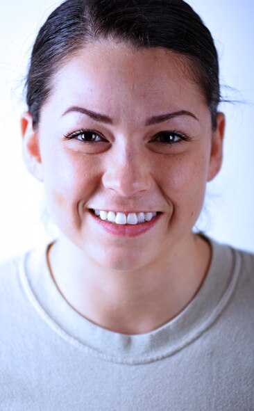 U.S. Air Force Second Lt. Briana Gent, the distinguished visitor flight officer with the 379th Air Expeditionary Wing protocol office, poses for a photo at Al Udeid Air Base, Qatar, Jan. 25, 2017. Gent continually builds strength in physical discipline and mental resiliency through setting and achieving fitness goals. (U.S. Air Force photo by Senior Airman Cynthia A. Innocenti)