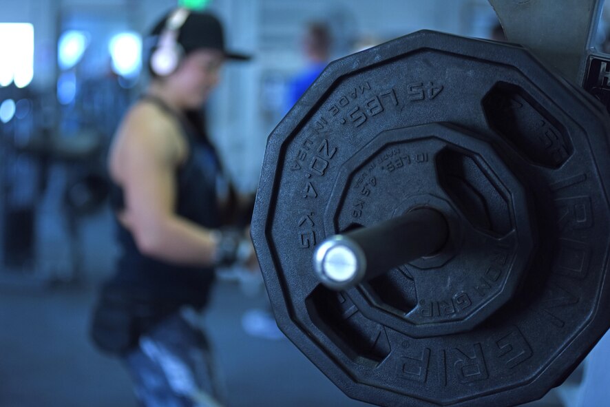 U.S. Air Force Second Lt. Briana Gent, the distinguished visitor flight officer with the 379th Air Expeditionary Wing protocol office, prepares to perform a squat rep at Al Udeid Air Base, Qatar, Feb. 2, 2017. Gent continually builds strength in physical discipline and mental resiliency through setting and achieving fitness goals. (U.S. Air Force photo by Senior Airman Cynthia A. Innocenti)