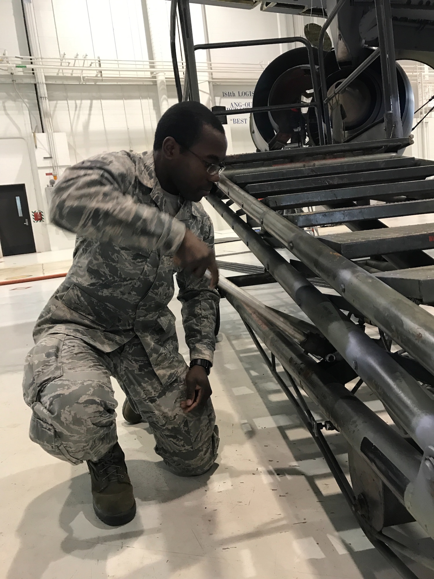 Staff Sgt. Thomas Carter, 931st Maintenance Squadron crew chief, tightens a bolt  as part of an inspection, Jan. 11, 2016, McConnell Air Force Base, Kan.  On Jan. 5, Carter noticed a fire in his apartment  building and alerted eight tenants that lived in his apartment complex.  (U.S. Air Force photo by Tech. Sgt. Abigail Klein)