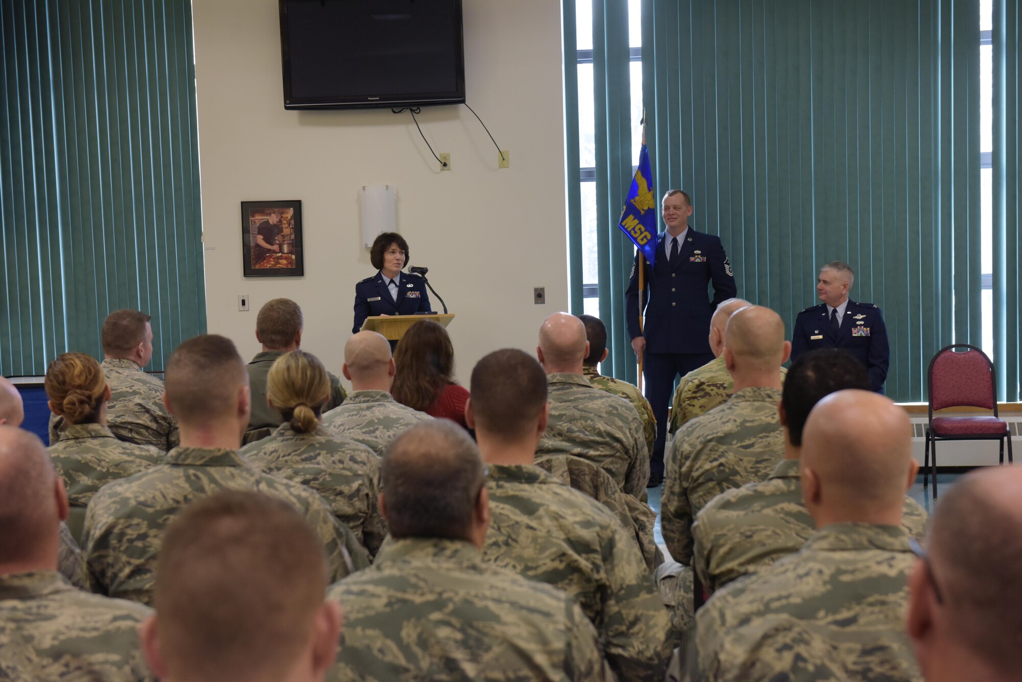 Col. Maureen Murphy, incoming 109th Mission Support Group commander, adresses the audience as Col. Shawn Clouthier, 109th Airlift Wing commander, looks on during the MSG change of command ceremony at Stratton Air National Guard Base, New York, on Feb. 4, 2017.  (U.S. Air National Guard photo by Staff Sgt. Ben German/Released)