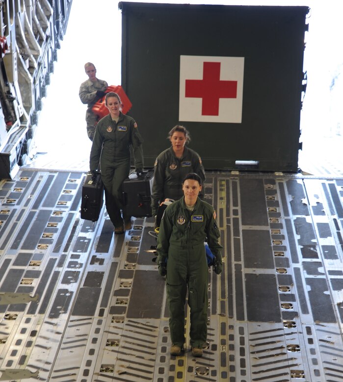 Flight nurses and medical technicians prepare a C-17 Globemaster III during an aeromedical evacuation exercise Feb 2. 2017. Citizen Airmen assigned to three aeromedical evacuation squadrons, participated in a multi-day exercise based out of MacDill AFB FL and Dobbins ARB Ga. (U.S. Air Force Photo by Tech Sgt. Peter Dean)
